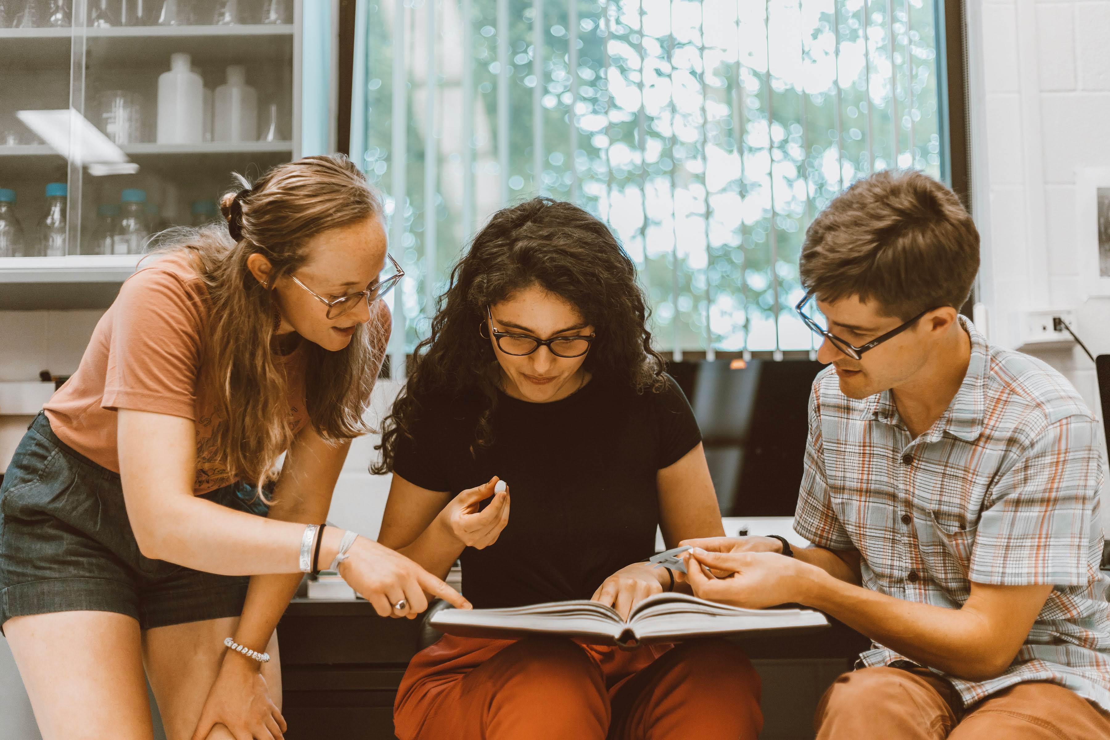 three scientists look at book